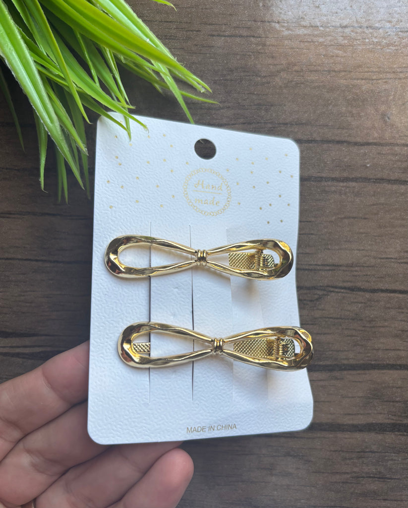 ٢ مشبك معدن لون دهبي سعر الكارت ٢٥