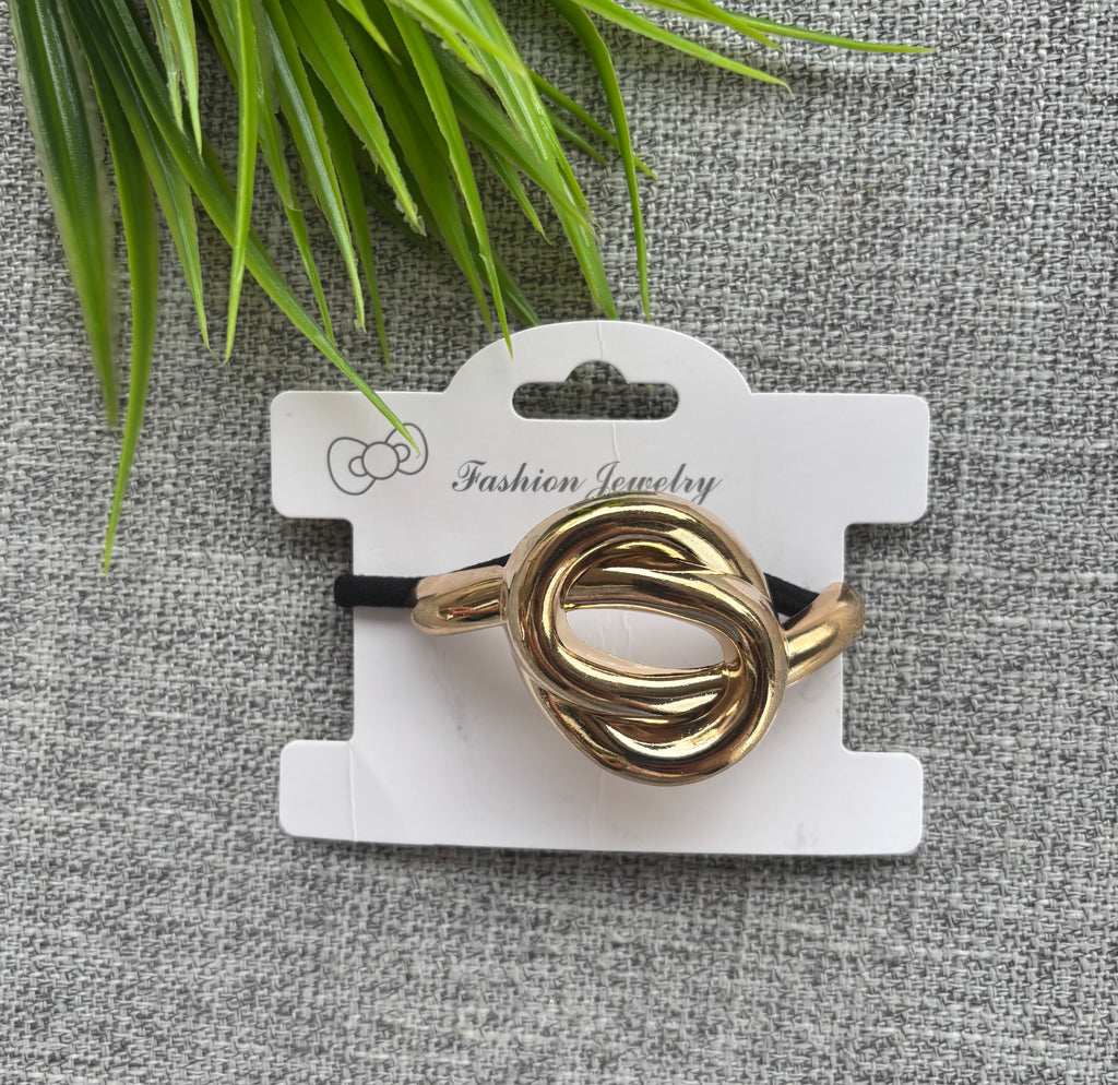 توكة معدن استك شكل عقدة لون دهبي السعر ٢٠